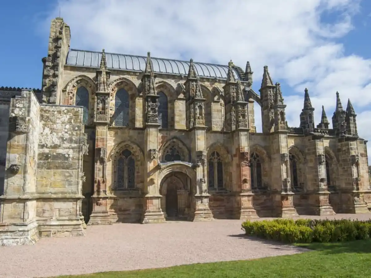 a large stone statue in front of a building