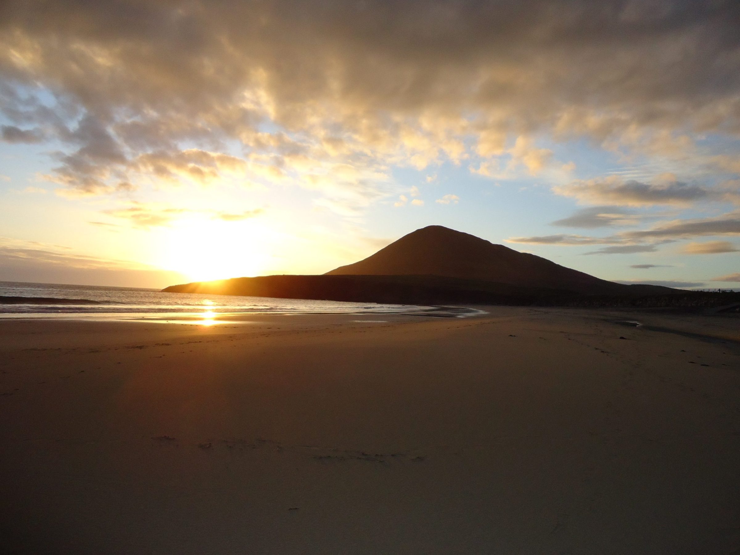 a sunset over a beach
