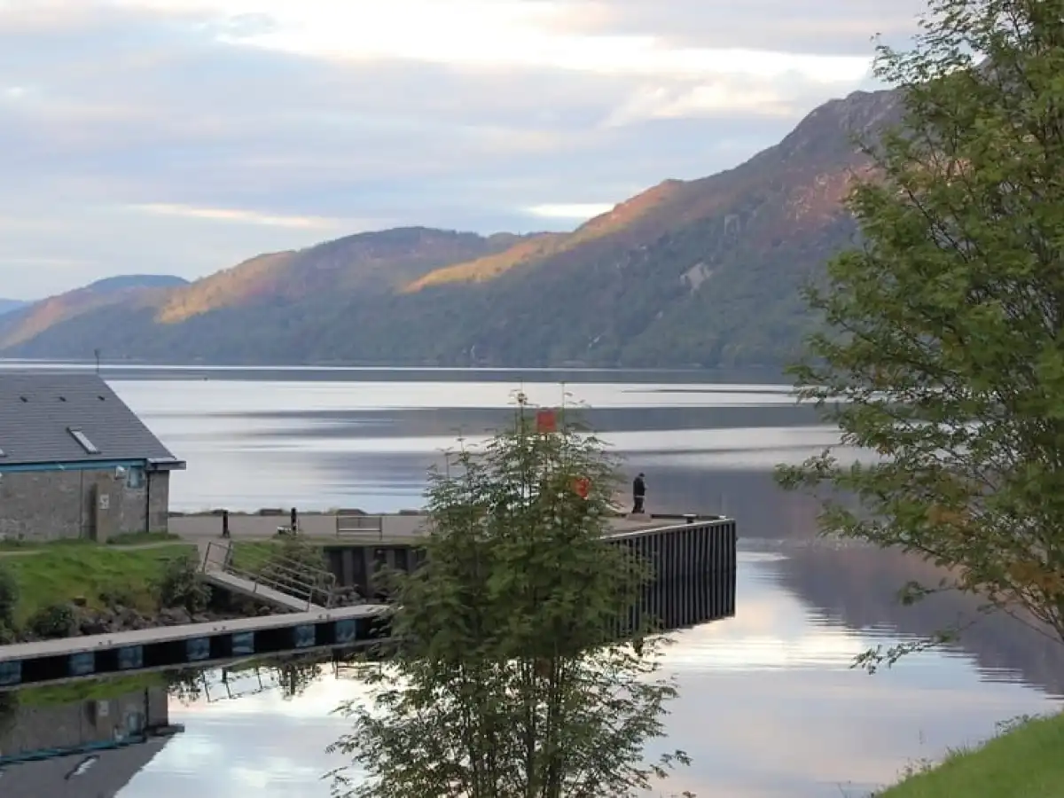 a house with a mountain in the background