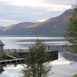 a house with a mountain in the background