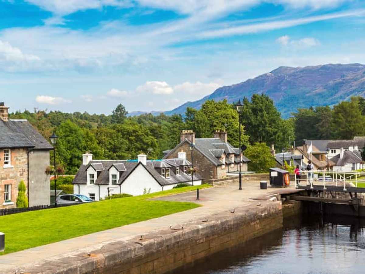 a small house surrounded by water