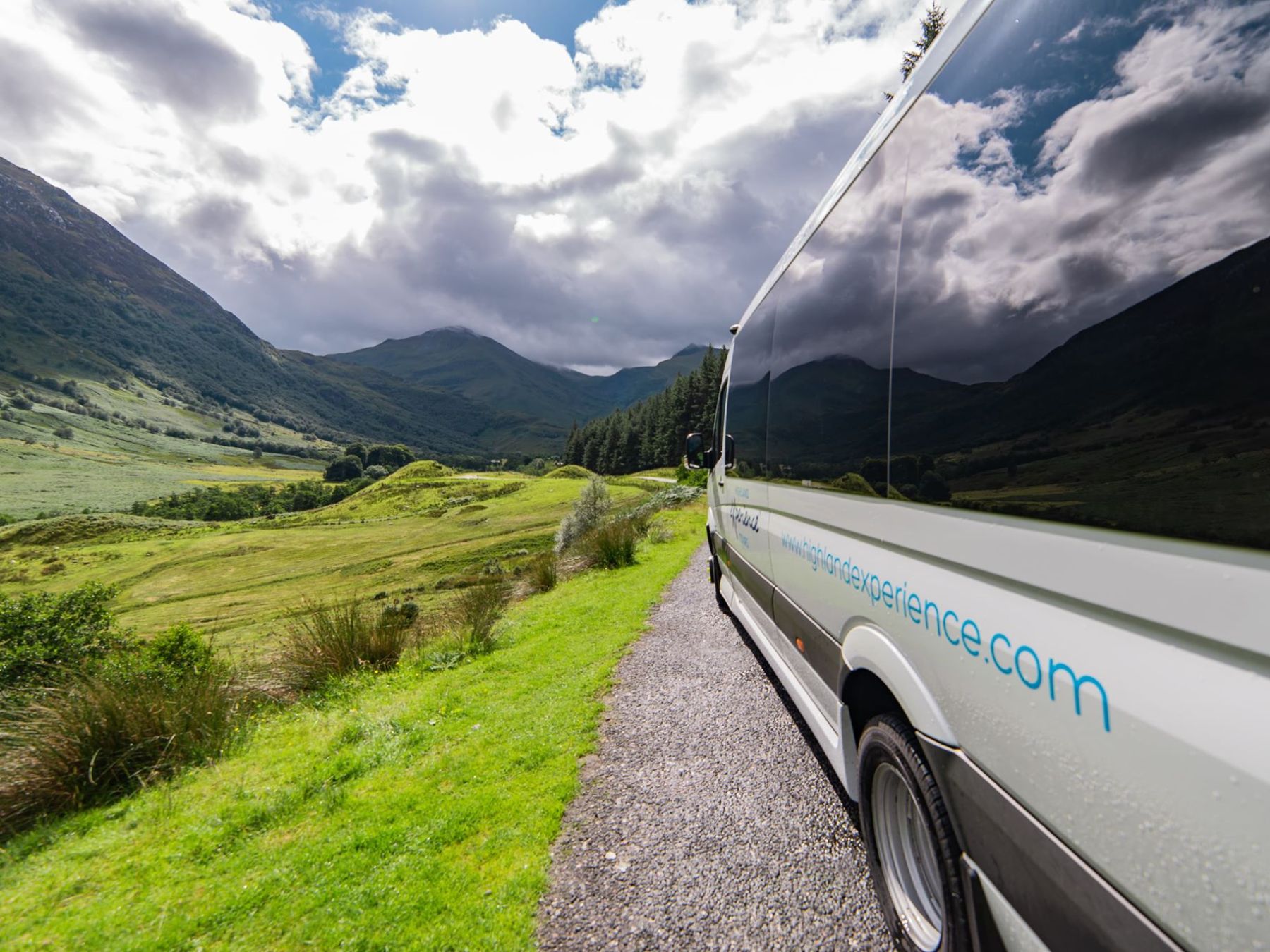 a car parked on the side of a mountain road