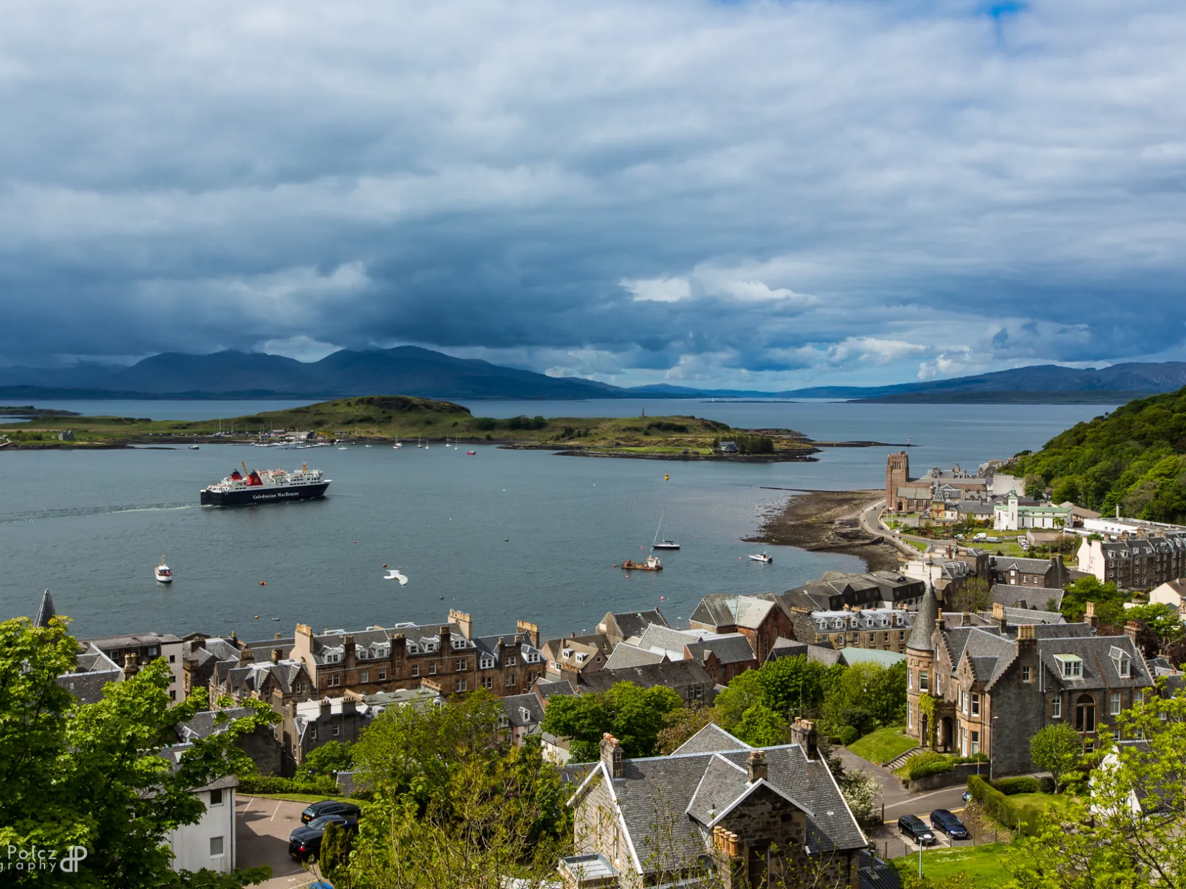 a large body of water with a city in the background