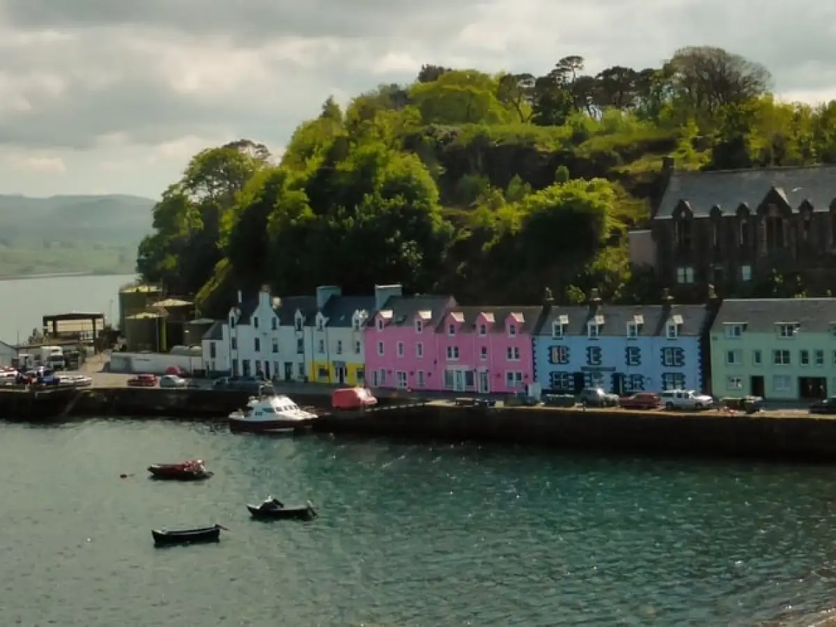 a boat is docked next to a body of water