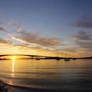 a sunset over a body of water