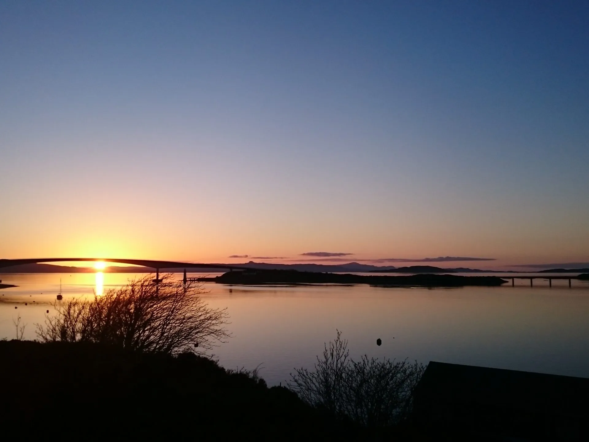 a sunset over a body of water