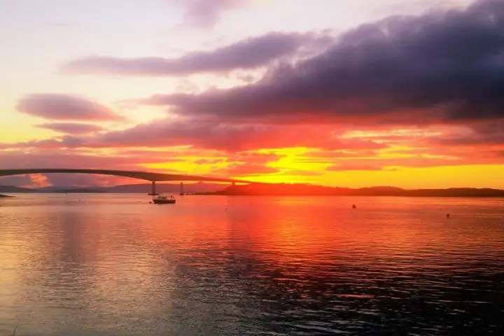 a sunset over a body of water