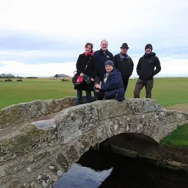 a group of people on a rock