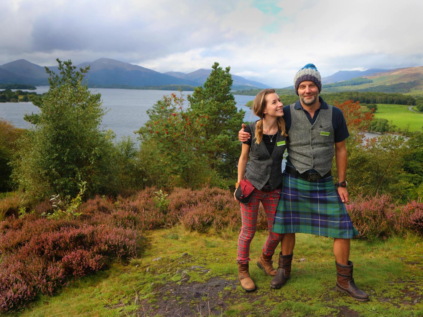 a person standing in front of a green field