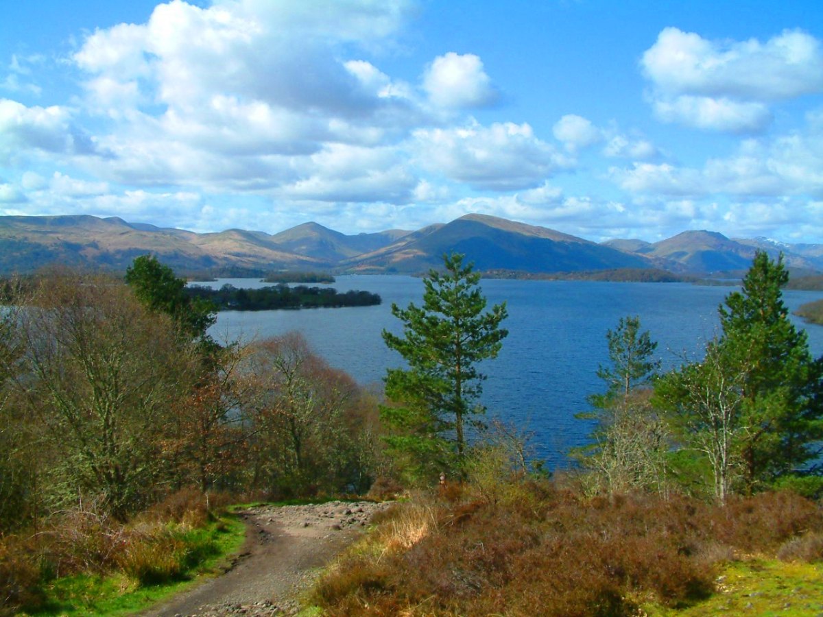 a body of water with a mountain in the background