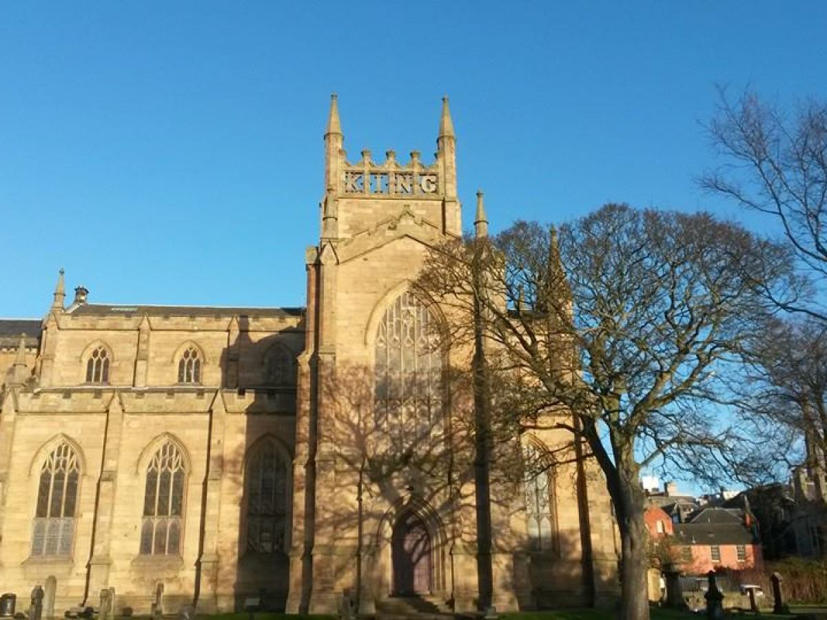 a large stone building with a clock tower