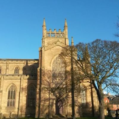 a large stone building with a clock tower