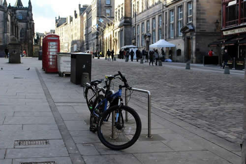 a bicycle parked on a city street