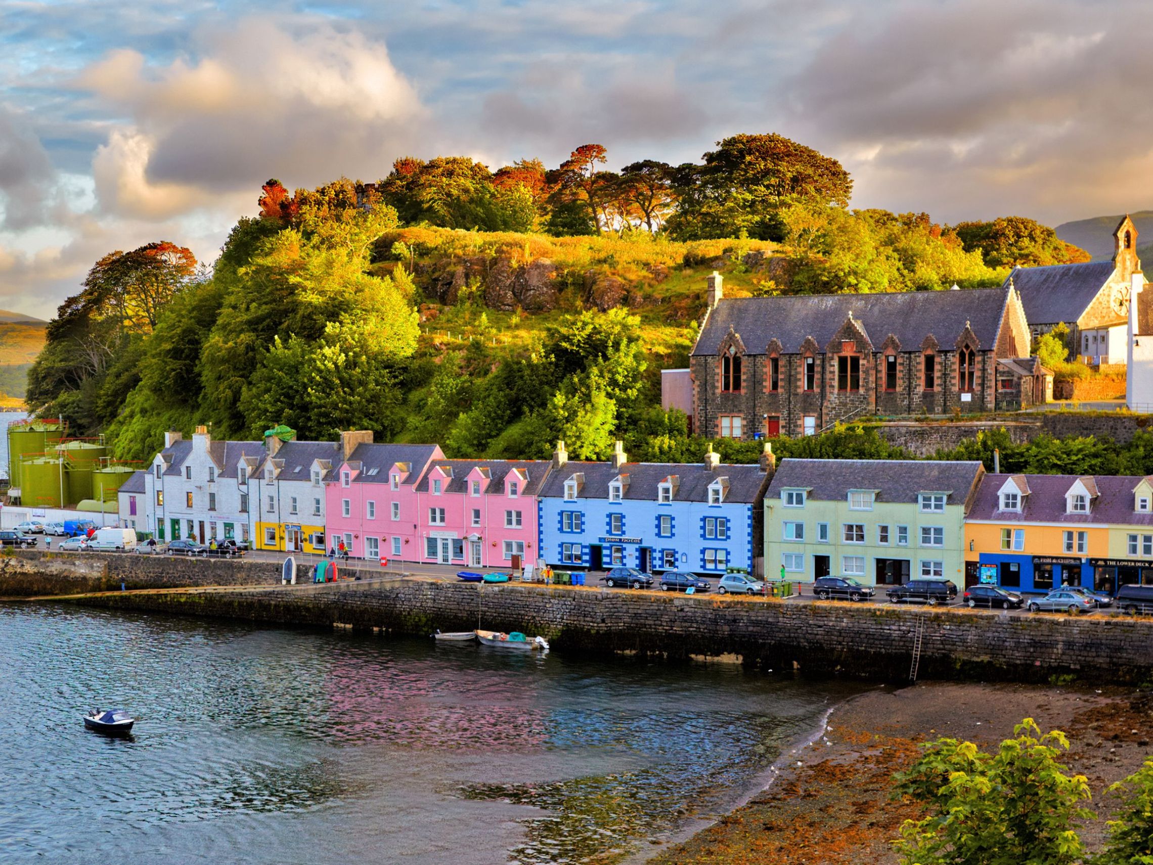 a small boat in a harbor next to a body of water