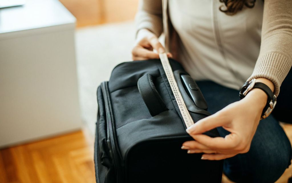 a woman sitting on a suitcase