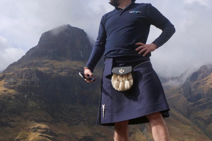 a man standing in front of a mountain