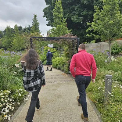a group of people standing in a garden