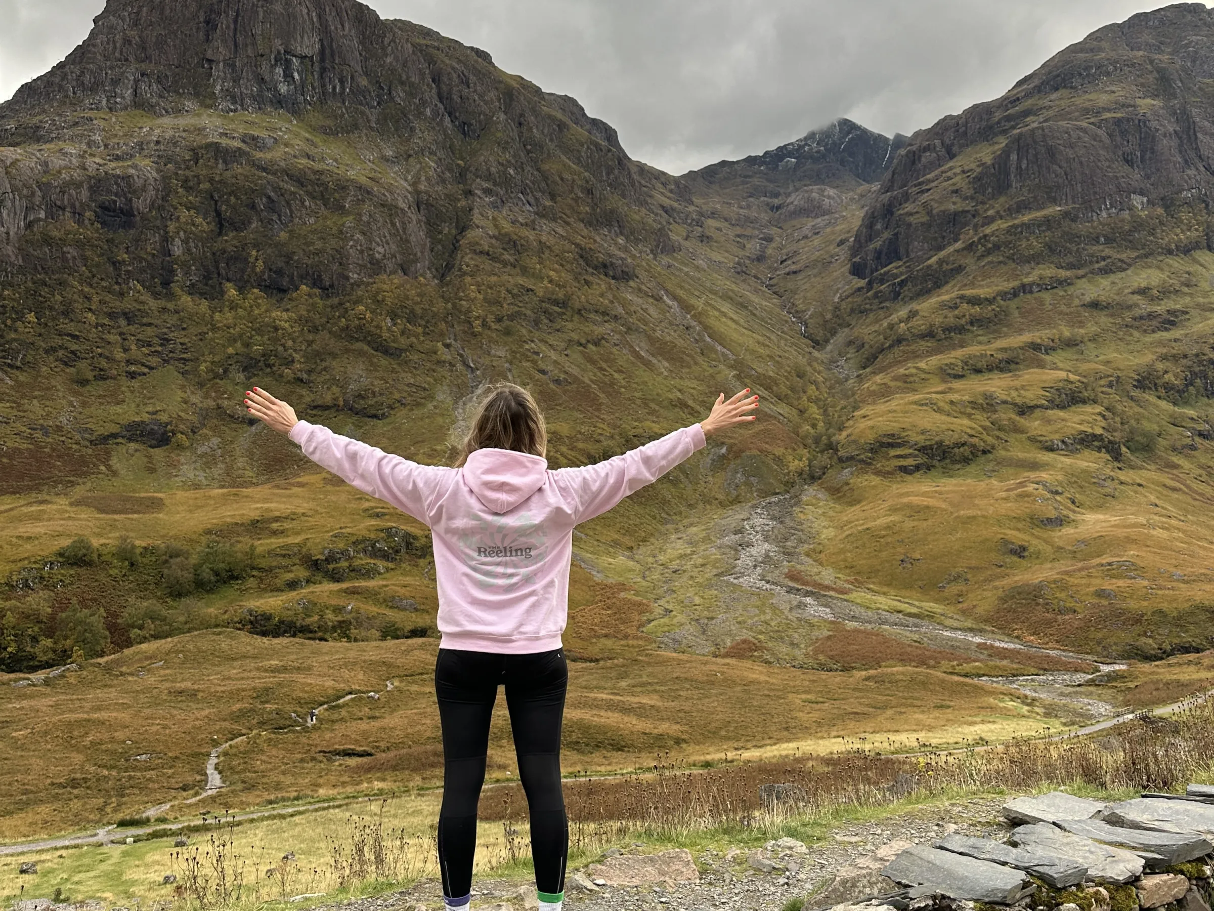 a person standing in front of a mountain
