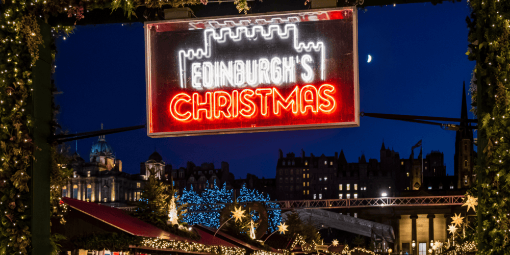 a sign lit up at night